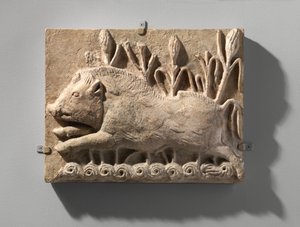 Wall panel with a charging boar, c.6th century AD