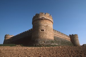 Three Corner towers and perimeter walls from below by Spanish School