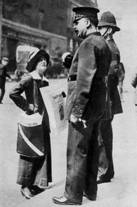 A suffragette confronting two policemen, 1913