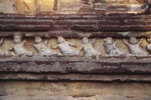 Relief depicting dwarves on the exterior of the Thivanka Image House by Sri Lankan