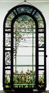 A leaded glass trellised window depicting clematis vines, early 20th century