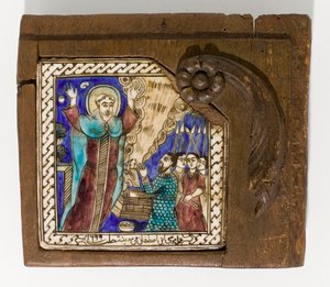 A signed and dated Syrian ceramic tile, painted in manganese, blue and brown, dated 1699 by Syrian School