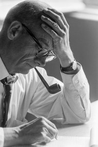 Dr. Benjamín Viel, Chilean doctor studies a document and smokes a pipe