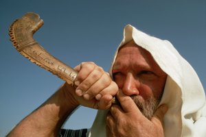 Man Blowing Shofar on Yom Kippur