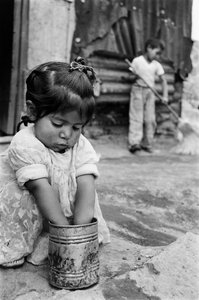 Two Young Children Outside Their Shanty in Mexico