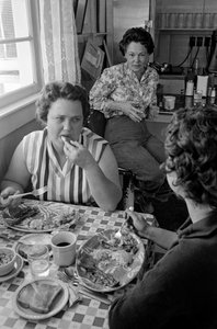 Women chat over breakfast in a diner in Oregon by Ted Spiegel
