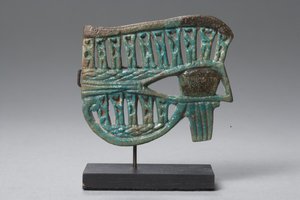 Wedjat eye amulet with figures of the god Nehebkau
