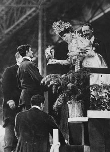 Queen Alexandra handing a special cup to Dorando to commemorate his great effort to win the Olympic marathon in July, 1908