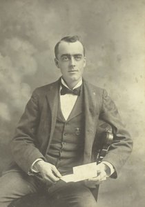 Untitled Portrait of Seated Man by Thompson Studio
