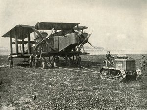 A Small Motor Tractor Getting a Huge R.A.F. Bombing Machine into Position by Unbekannt