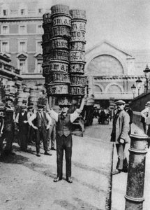 A man carrying many baskets on his head, Covent Garden, London