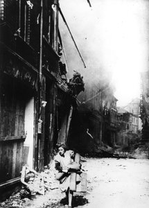 A Woman Leaving Her Burning House in a Bombed Street, Germany