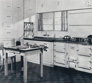 Aga Heat Ltd. The Model F Aga Cooker for a large house finished in black and cream vitreous enamel
