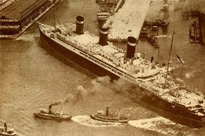 An Aerial Photograph of the Leviathan Being Towed by Small Tugs into Her Dock at New York
