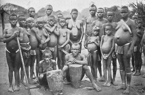 Bambute Pygmy Group with Two Walese Women by Unbekannt