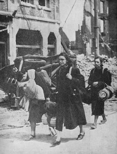 British troops hold out in Louvain as refugees leave the city, 1940