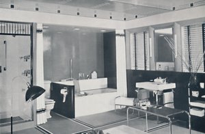 Crane Co. - A Black, White, Red and Grey Scheme with an Unglazed Ceramic Tile Floor, Oyster-White Walls