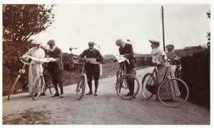 Cyclists looking at maps, c 1900