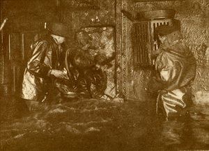 Divers Plugging A Leak During Salvage Operations Waist-Deep In Water On the Lower Decks Of The Germ by Unbekannt