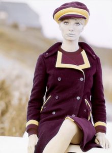 Fashion: young woman wearing a cap and a coat, late 1960s-early 1970s by Unbekannt