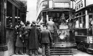 Getting on to a tram at Blackfriars, London