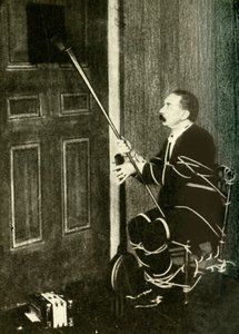 John Nevil Maskelyne performs a spirit cabinet illusion, c1910 by Unbekannt