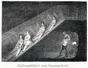 Salt mine: descent system by slide and work of a miner breaking the salt into pieces