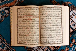 Open Quran and prayer mat, Tunisia