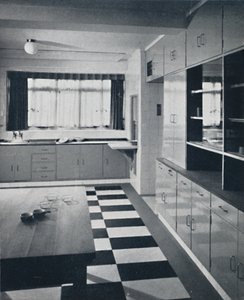 R. W. Symonds and Partner, L. & A.R.I.B.A. - Kitchen: Putty-coloured cellulosed fittings, stainless