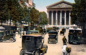 Rue Royale and the Madeleine, Paris, with cars and a motorbus on the street