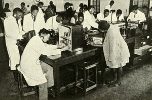 Scenes in a Native College - Students in the physics laboratory by Unbekannt
