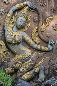 Statue of the goddess Phra Mae Thorani, Earth goddess protector of Buddha, Wat Inpeng, Vientiane, Laos