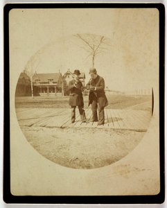 Two men on a boardwalk, c 1890