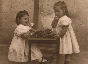Two Young Girls by a Table by Unbekannt