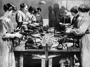 Women cobblers repairing footwear for the war effort by Unbekannt