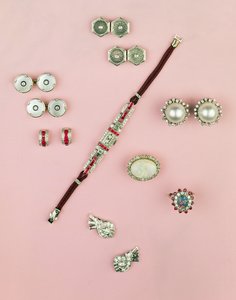 Selection of Art Deco jewellery; calibre cut ruby watch; button, cufflink and studs; earrings; Mabe pearl and diamond earrings