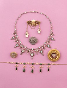 Selection of Victorian jewellery: tourmaline and split pearl fringe necklace; rose-cut diamond oval brooch; opal and diamond necklace; cabochon amethyst star brooch; Essex crystal of snarling tiger