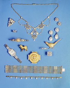 Selection of jewellery: pearl and gold pendant; Art Deco diamond clip brooch; pearl drop earrings; Celtic style gold brooch; Edwardian chain bracelet; pheasant brooch; half pearl gold hinged bangle
