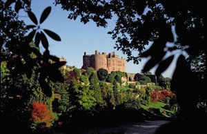 View from the garden showing medieval towers and alterations which began in 1587