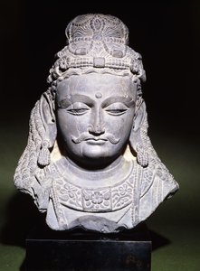 A large head of a Bodhisattva with a downcast expression, 2nd-3rd century