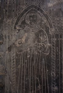 Fragment of a Stone plate. Bas-relief. A church official.