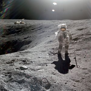 Charles M. Duke, Jr., lunar module pilot of the Apollo 16 mission, collecting lunar samples at the rim of Plum Crater, April 1972 by Unbekannt