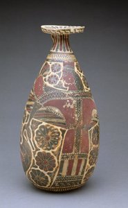 Corinthian black-figured alabastron, with a winged 