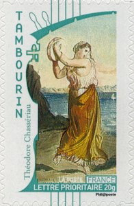 French postage stamp showing a gypsy woman playing the tambourine