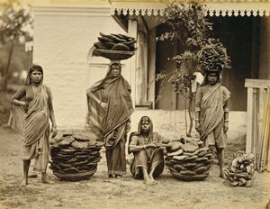 Indian Peasant Women with Baskets of Dung Cakes and Kindling Wood