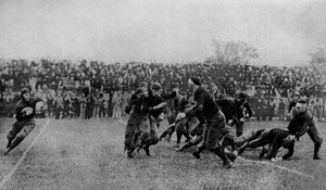 North America. Midfield play at an American football match. 1920