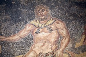 Polypheme Hall. Detail of the cyclope devouring the entrails of a goat. 3rd - 4th century. Roman Villa of the Casale, Sicilia. UNESCO site.