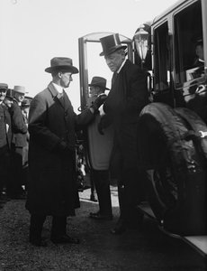 President Woodrow Wilson alighting from an automobile. Washington, DC, circa 1918