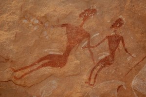 Rock art, Prehistory: Detail of a rock painting of two characters in an ornate shelter, in the Uweinat massif, Egypt (Period from 8000 to 3000 years BC). Photography by Unbekannt