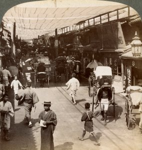 Midsummer Traffic Under the Awnings of Shijo Bashidori, a Busy Thoroughfare of Kyoto, Japan